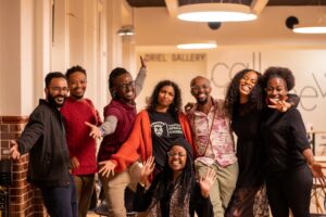 A group of people smiling and posing for the camera.